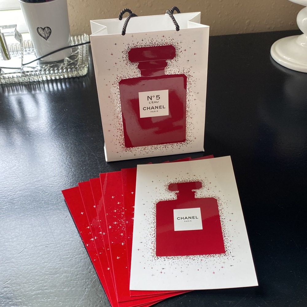 Set of 6 Chanel post cards and small paper bag. New not used.